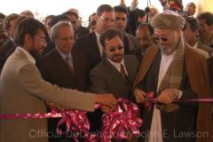 BAMIAN PROVINCE, Afghanistan - Mohammad Abdul Karim Khalili, vice president of Afghanistan, cuts the ribbon blocking the doorway to Bamian University during a ceremony here April 3. The university was formerly used as a headquarters by the Taliban in 1998 and was subsequently bombed by the U.S. in 2001. After reconstruction coordinated by the Bamian Provincial Reconstruction Team, comprised of coalition members from New Zealand, the United States, the United Kingdom and Afghanistan, the university was publicly re-opened. (Official Marine Corps photo by Lance Cpl. John E. Lawson Jr.)
