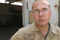 AL ASAD, Iraq – Lance Cpl. Patrick R. Dewey, a 22-year-old machinist and Seattle native with the machinist and welding shop, Combat Logistics Battalion 2, 2d Force Service Support Group (Forward), takes a break after the four-Marine team completed building a custom-designed cable trailer to meet the needs of Marines operating in Western Iraq. (Photo by Cpl. John E. Lawson Jr.)